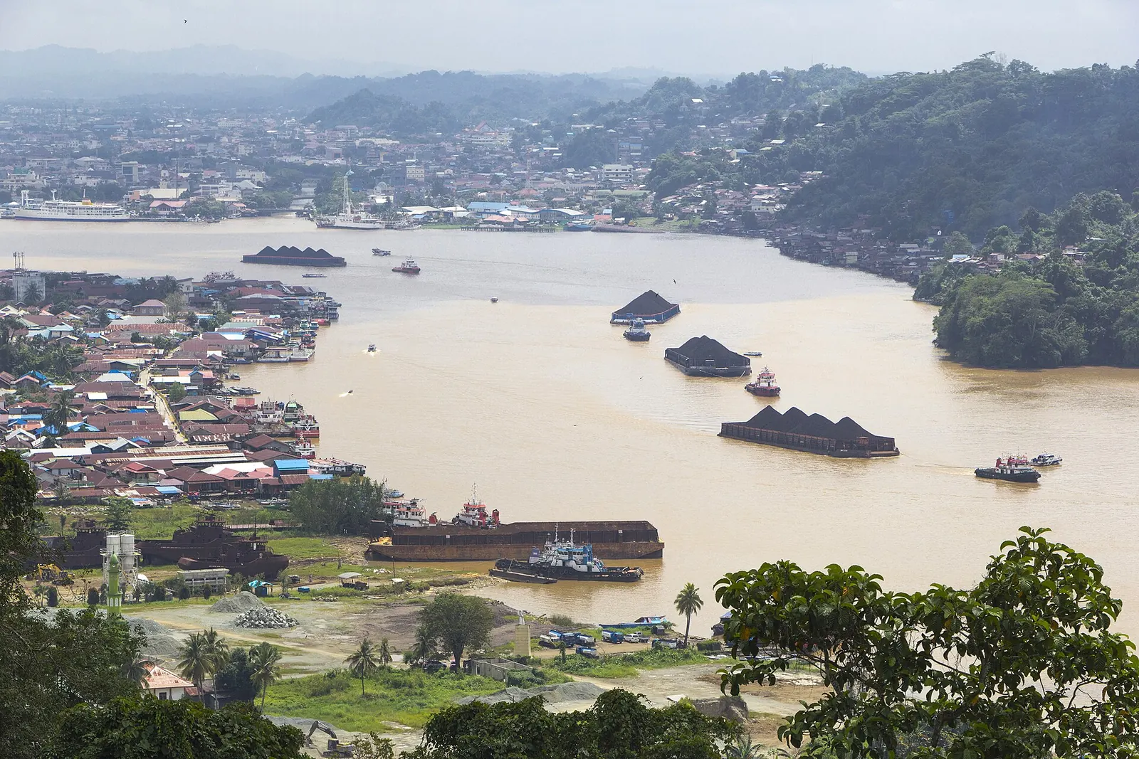 Coal barges on the Mahakam River, East Kalimantan, Indonesia